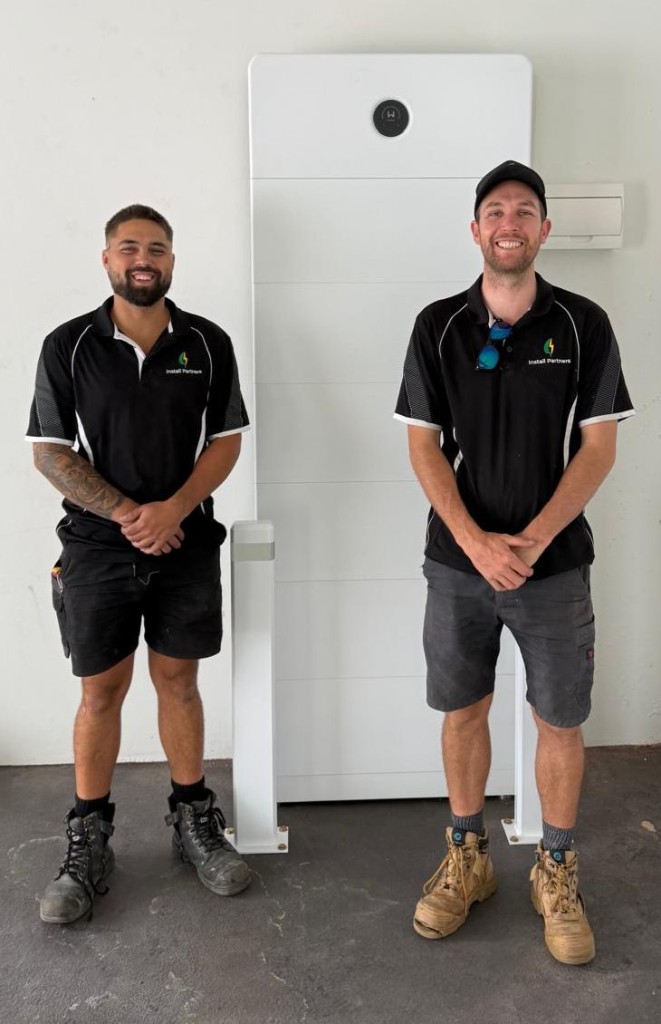 Install Partners Aus founders with a solar battery unit